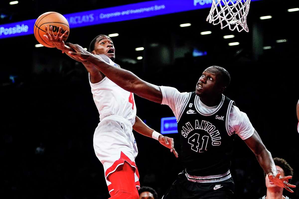 San Antonio Spurs' Gorgui Dieng (41) defends Brooklyn Nets' Edmond Sumner during the second half of an NBA basketball game, Monday, Jan. 2, 2023, in New York. The Nets won 139-103. (AP Photo/Frank Franklin II)