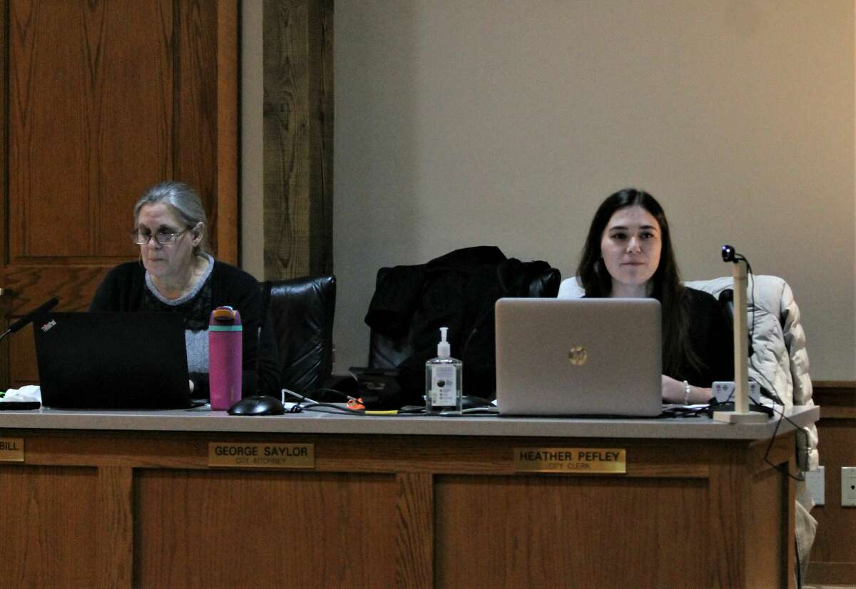 Katie Mehl (right), Manistee County planning and zoning administrator, fields a question Jan. 5 during a public hearing regarding duplexes in Manistee's R-2 district.