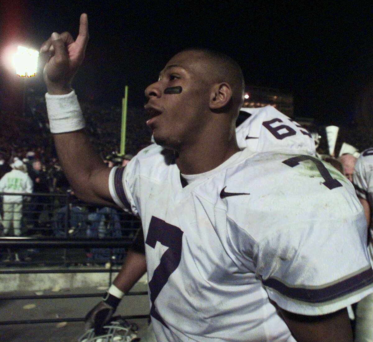 Kansas State Wildcats' quarterback Michael Bishop (7) signals number one to fans as he leaves the field following their 31-25 victory over the University of Missouri Saturday, Nov. 21, 1998 in Columbia, Mo. Kansas State (11-0, 8-0) is heading to the Big 12 championship game Dec. 5 against Texas A&M, where it will be shooting for its 20th straight victory.