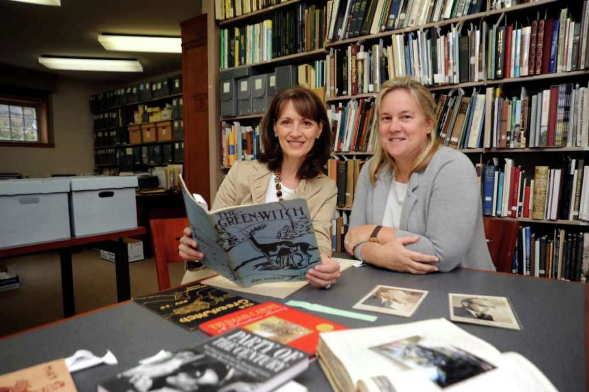 Regina Pitaro, left, of Greenwich, member of the board of Greenwich Historical Society and Amy Mooney, filmmaker, producer, look at books and memorabilia of Truman Capote, on Tuesday, Oct. 12, 2010, for a film they are making about Capote in Greenwich, for Historical Society's upcoming fundraiser.