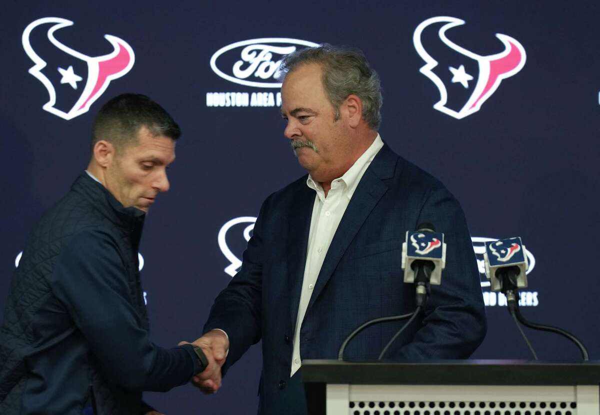 Texans CEO Cal McNair, right, and GM Nick Caserio announced another one-and-done head coach Monday with Lovie Smith's hiring.