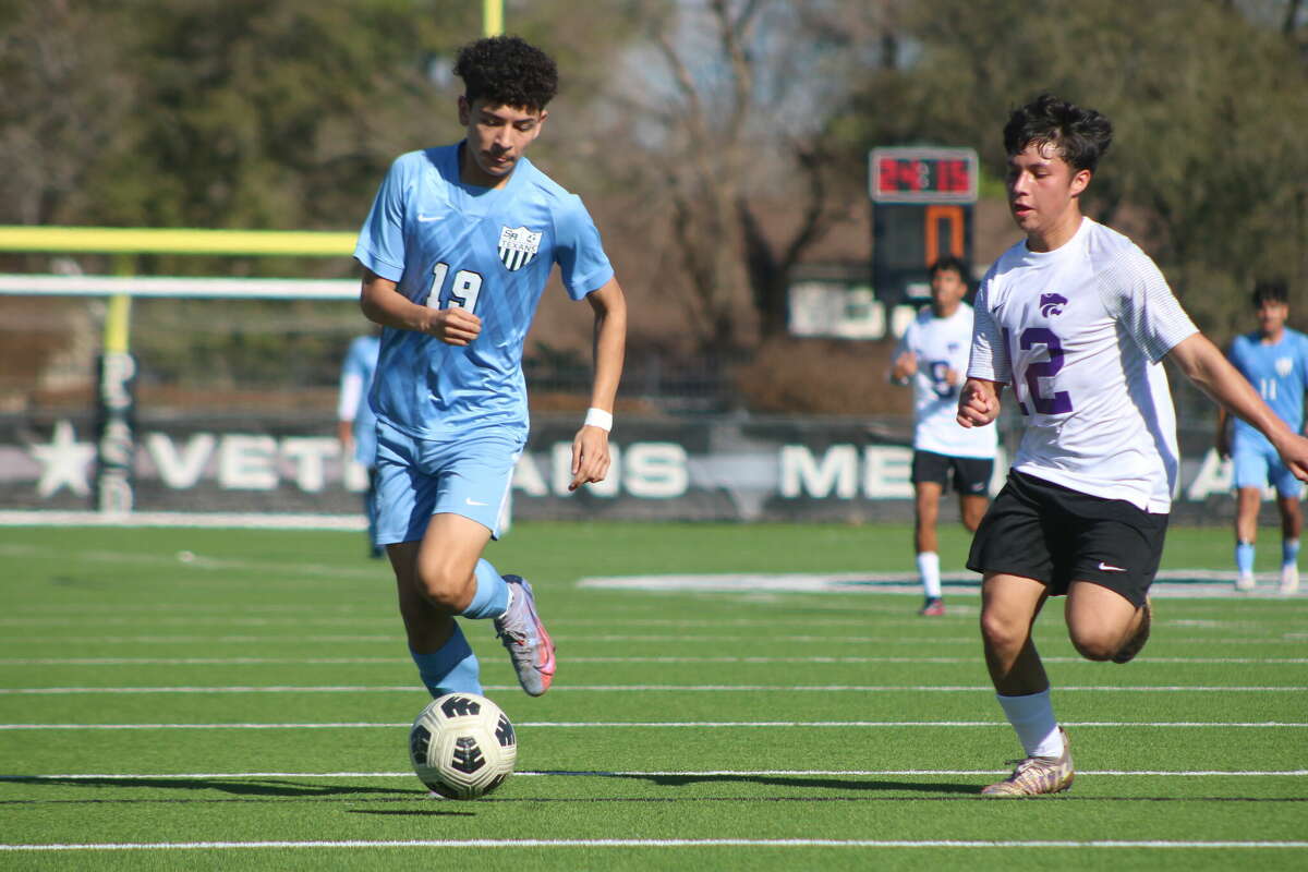 Sam Rayburn's Alexandro Cantu races down the Veterans Memorial turf looking for a shot on goal, while an Angleton player gives chase.