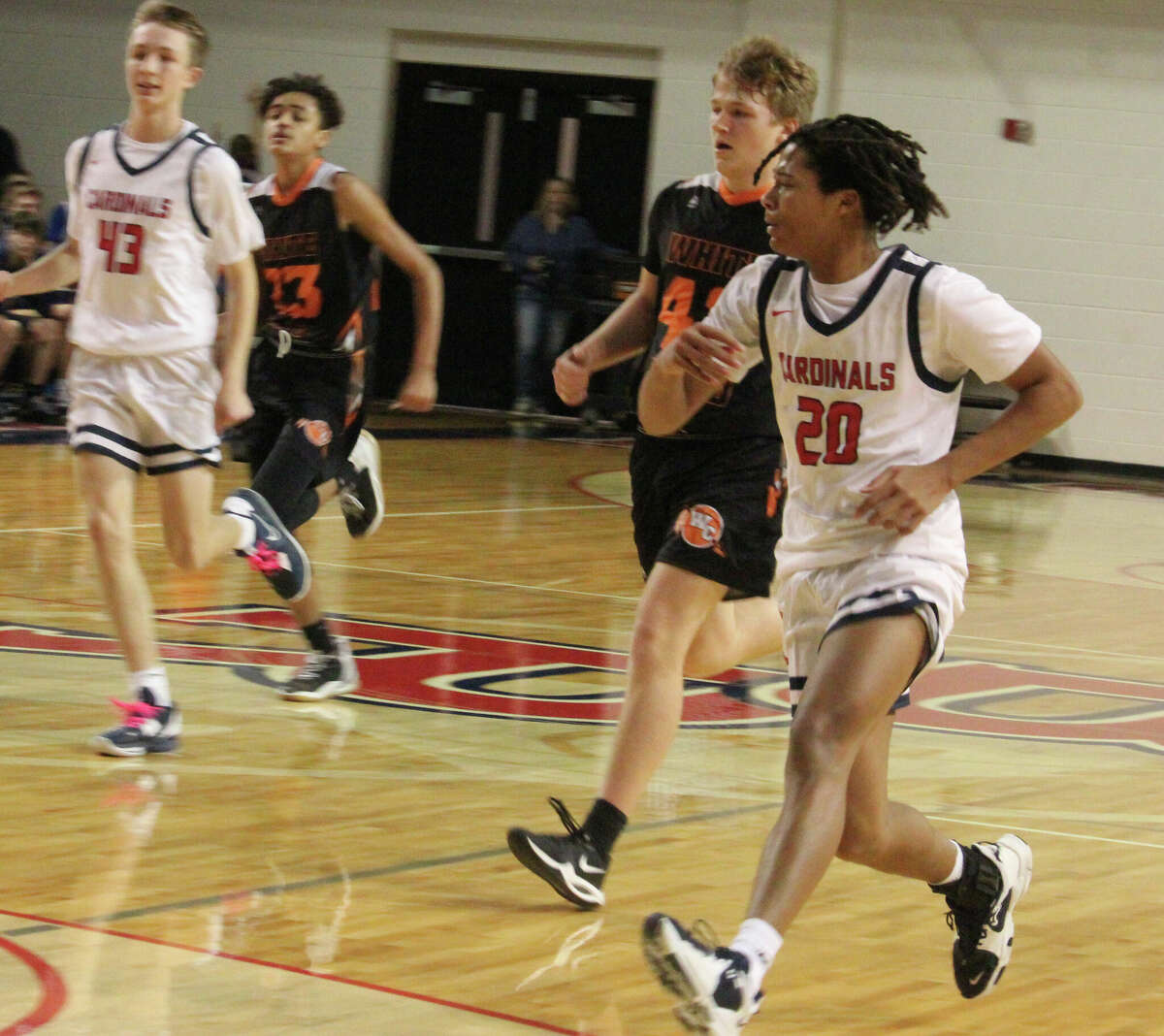 Big Rapids' Karlito McKinney (20) hustles down the court during Friday action against White Cloud.