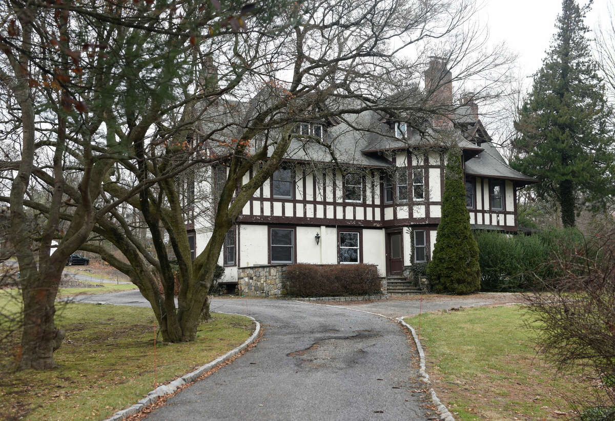 The home at 51 Dearfield Dr. in Greenwich, Conn., photographed on Tuesday, Jan. 10, 2023. A preliminary plan proposes to demolish the homes at the adjoining properties of 51 and 69 Dearfield Dr. to build an affordable development with 105 residential units.