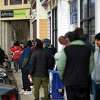 People stand in line at the Affinity Health and Wellness dispensary on Whalley Avenue in New Haven before the opening time on the first day of cannabis sales for adults 21+ personal use on January 10, 2023.