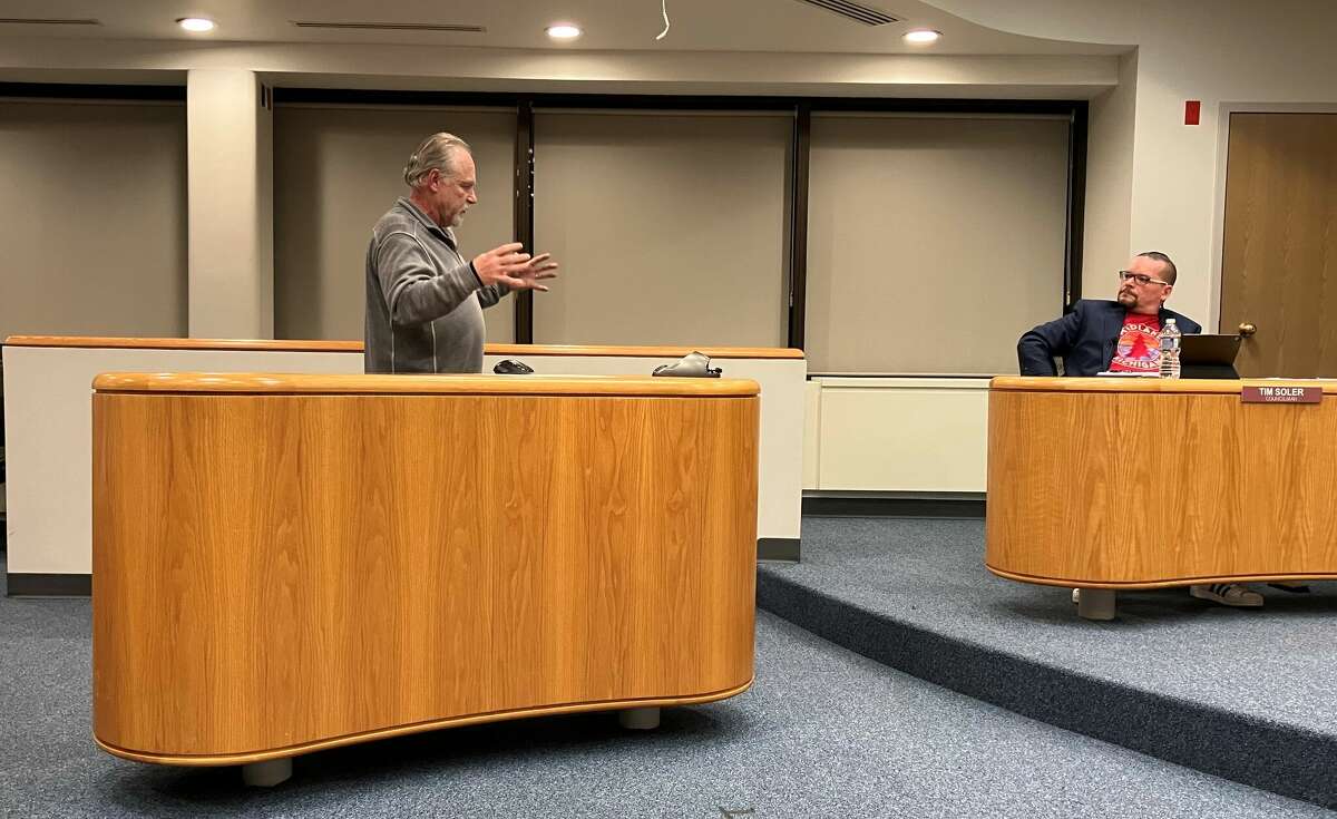 Mike Hirst, left, addresses Midland City Councilman Tim Soler, right, and the rest of the council about a resolution for Andy’s Place apartments during a meeting Jan. 9, 2023 at City Hall. Andy's Place was named in honor of Hirst's son, Andy Hirst, who died of a heroin overdose.