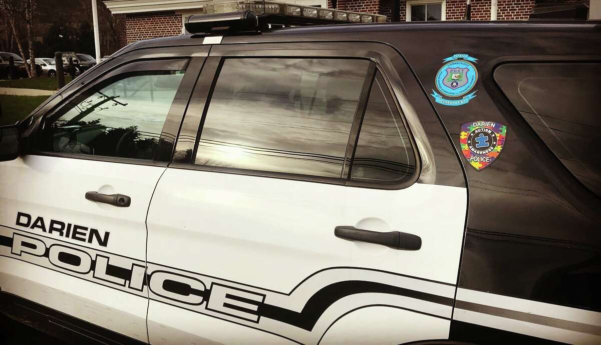 A 21-year-old Bridgeport man was charged with a burglary offense Wednesday after he was seen trying car doors at Darien Train Station, according to local police.
