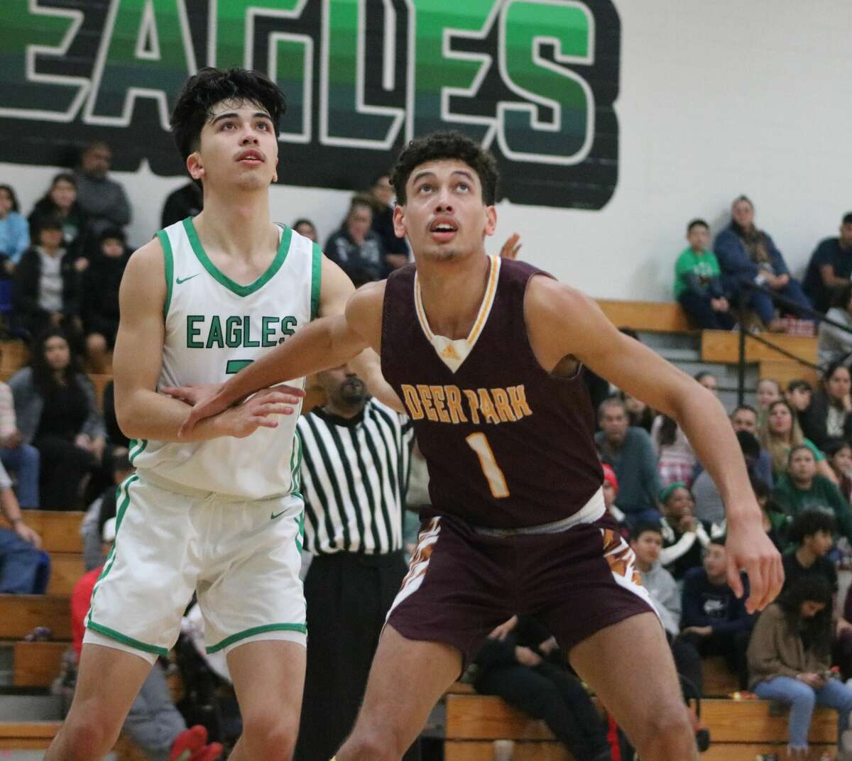 Deer Park's Nicholas Buffalo keeps a Pasadena player away from the ball during their district-opening game last month. Both teams will be home Tuesday night.