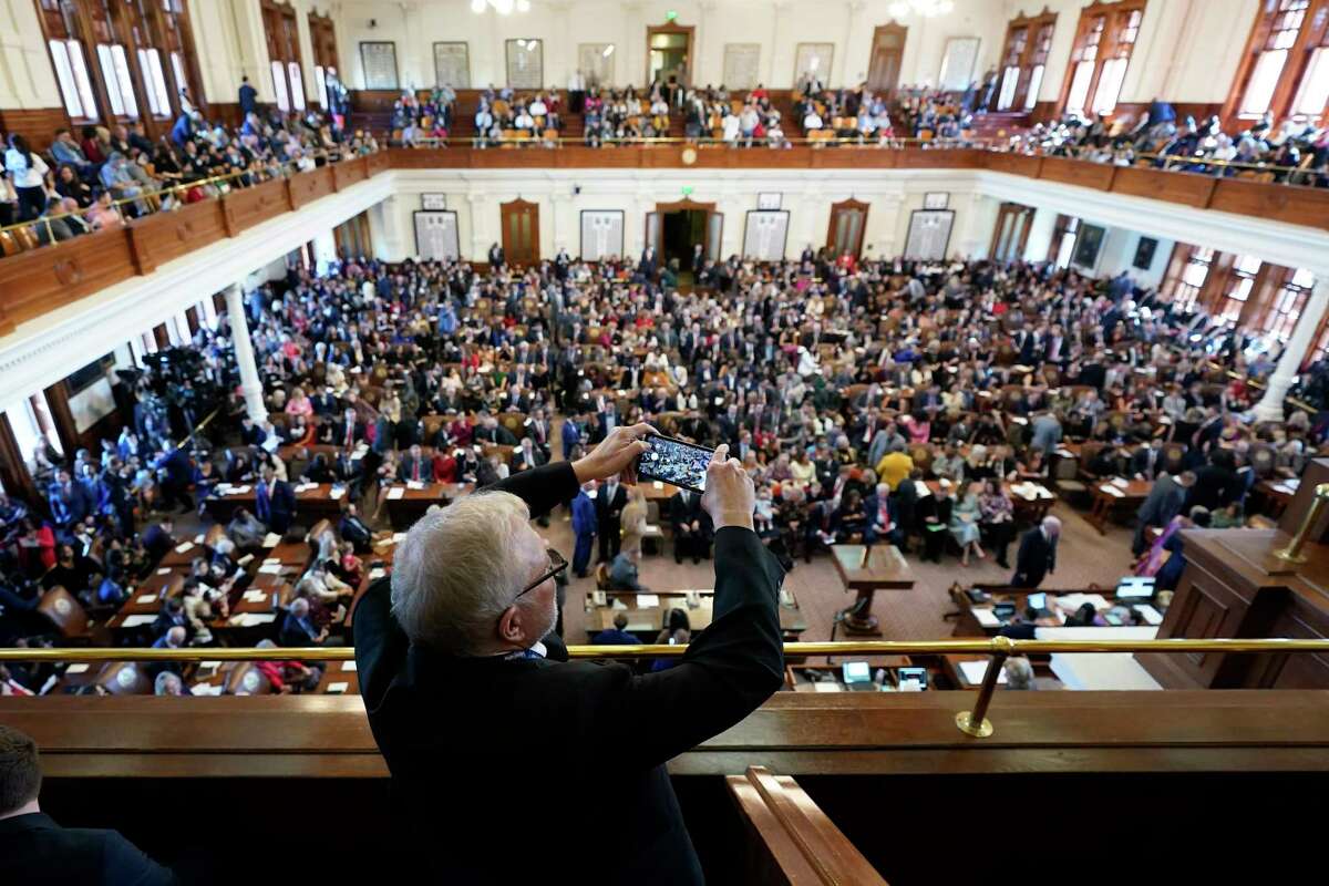 Michael Hailey photographs the House Chamber at the Texas Capitol on the first day of the 88th Texas Legislative Session in Austin, Texas, Tuesday, Jan. 10, 2023.