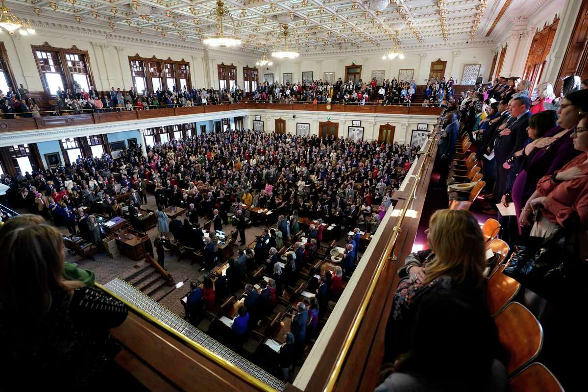 Texas House members with family and guests crowd the House Chamber at the Texas Capitol for the opening of the 88th Texas Legislative Session in Austin, Texas, Tuesday, Jan. 10, 2023.