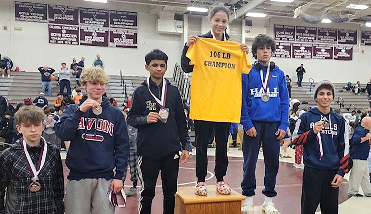 Ledyard freshman Tatianna Irizarry on the top of the podium after winning the 106-pound weight class at the Bristol Centrai Invitational on Saturday, Jan. 9, 2023. Irizarry is the first female wrestler to finish first at the tournament, which began in 1981.