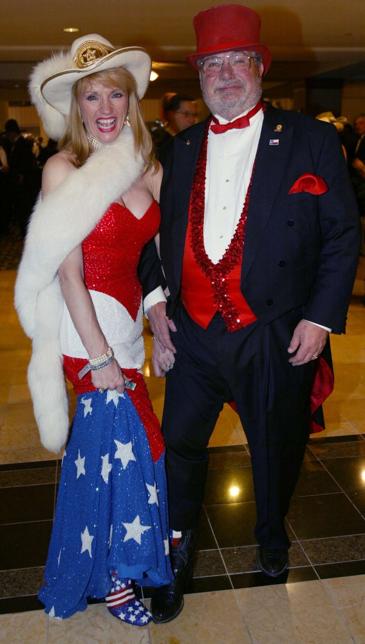 Woodlands residents Nelda Blair and her husband Jim sport colorful, patriotic outfits at the Texas Black Tie and Boots Ball in Washington DC Wednesday Jan. 19, 2005. The dress was made by Dallas designer Mike Benet, while Blair sewed the husband's vest herself. 