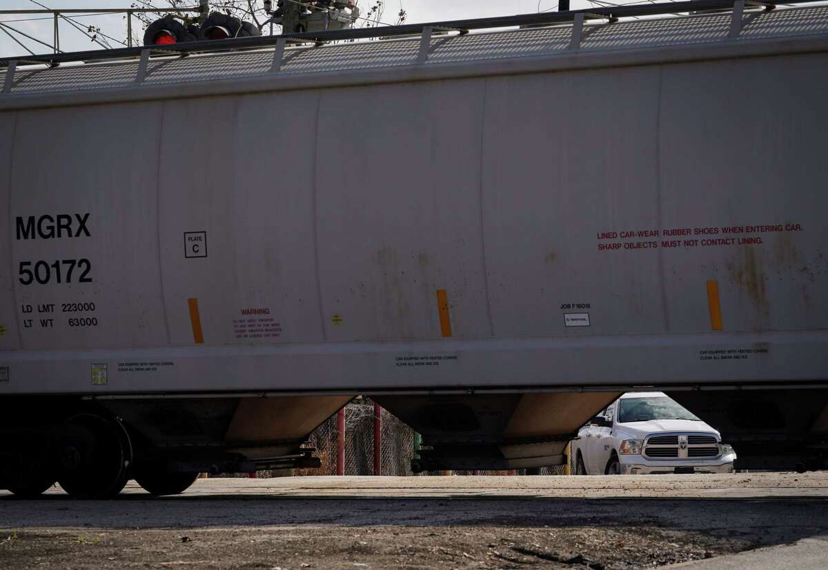 A stopped train blocks traffic on Hirsch Road on Tuesday, Jan. 10, 2023, in the Fifth Ward neighborhood in Houston.