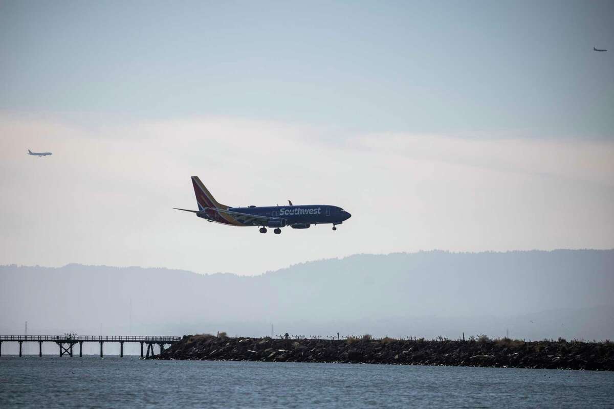 A Southwest Airlines flight approaches the runway at Oakland International Airport in December. The airport reached 91% of pre-pandemic levels in November.