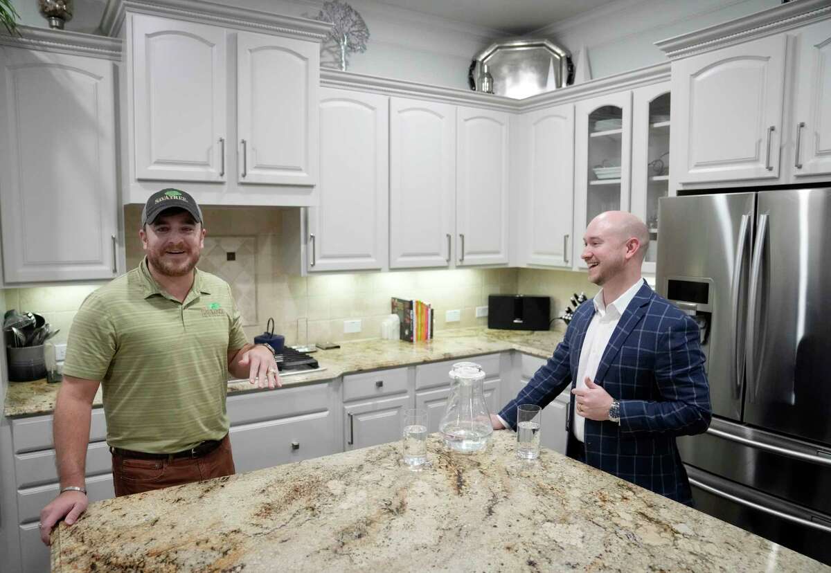 Johnny Dailey, left, and Aaron Dailey, right, talk about painting the kitchen cabinets and other changes they have made in their home shown Tuesday, Jan. 10, 2023, in Spring.