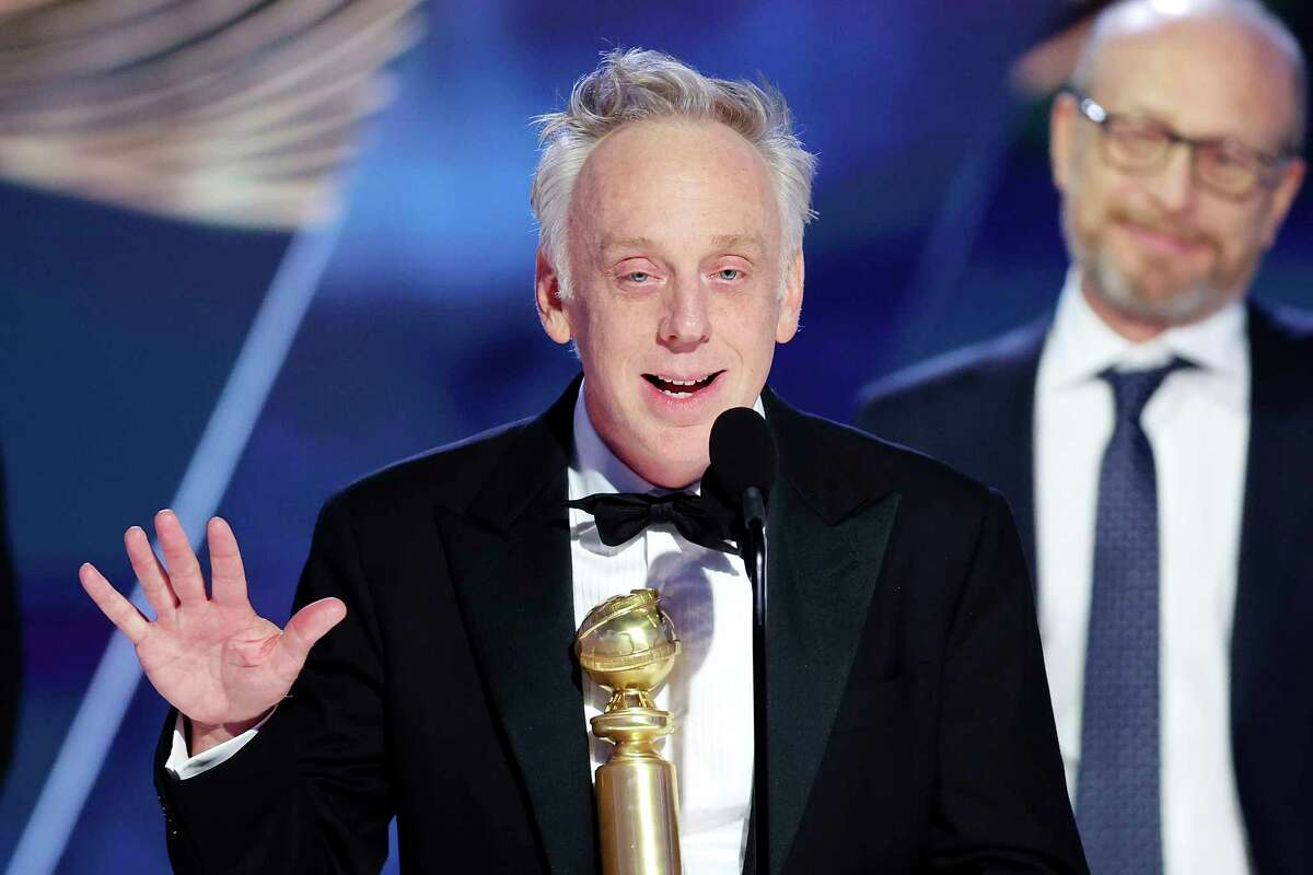 This image released by NBC shows Mike White accepting the Best Limited or Anthology Series or Television Film award for "The White Lotus" during the 80th Annual Golden Globe Awards at the Beverly Hilton Hotel on Tuesday, Jan. 10, 2023, in Beverly Hills, Calif. (Rich Polk/NBC via AP)