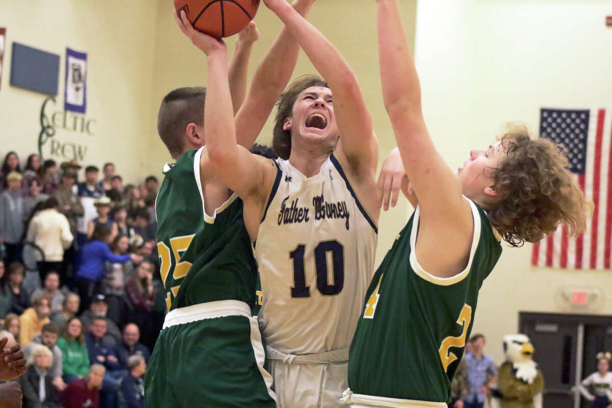 Father McGivney's Jackson Rodgers goes up for a layup against Metro-East Lutheran on Tuesday in Glen Carbon. Rodgers scored 19 points in the Griffins' 60-54 Gateway Metro Conference win. 
