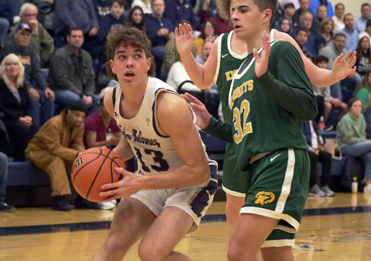 Father McGivney's Evan Schrage in action against Metro-East Lutheran on Tuesday in Glen Carbon. The Griffins won 60-54 in the Gateway Metro Conference matchup. 