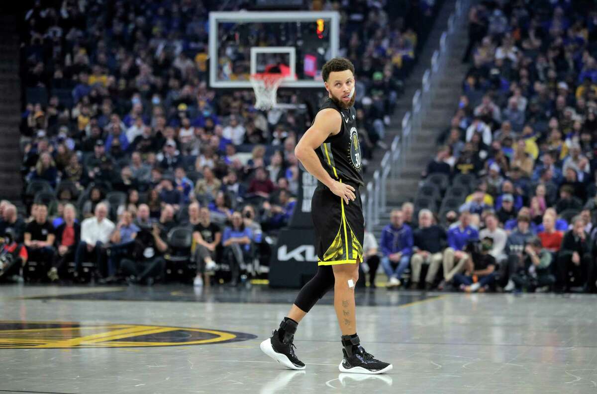 Stephen Curry (30) walks around the court during a break in action in the first half as the Golden State Warriors played the Phoenix Suns at Chase Center in San Francisco, Calif., on Tuesday, January 10, 2023.