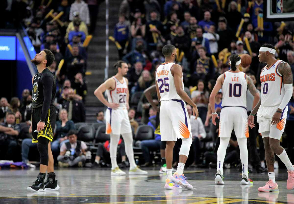 Stephen Curry (30) gathers himself after fouling Damian Lee (10) sending him to the line in the second half as the Golden State Warriors played the Phoenix Suns at Chase Center in San Francisco, Calif., on Tuesday, January 10, 2023.