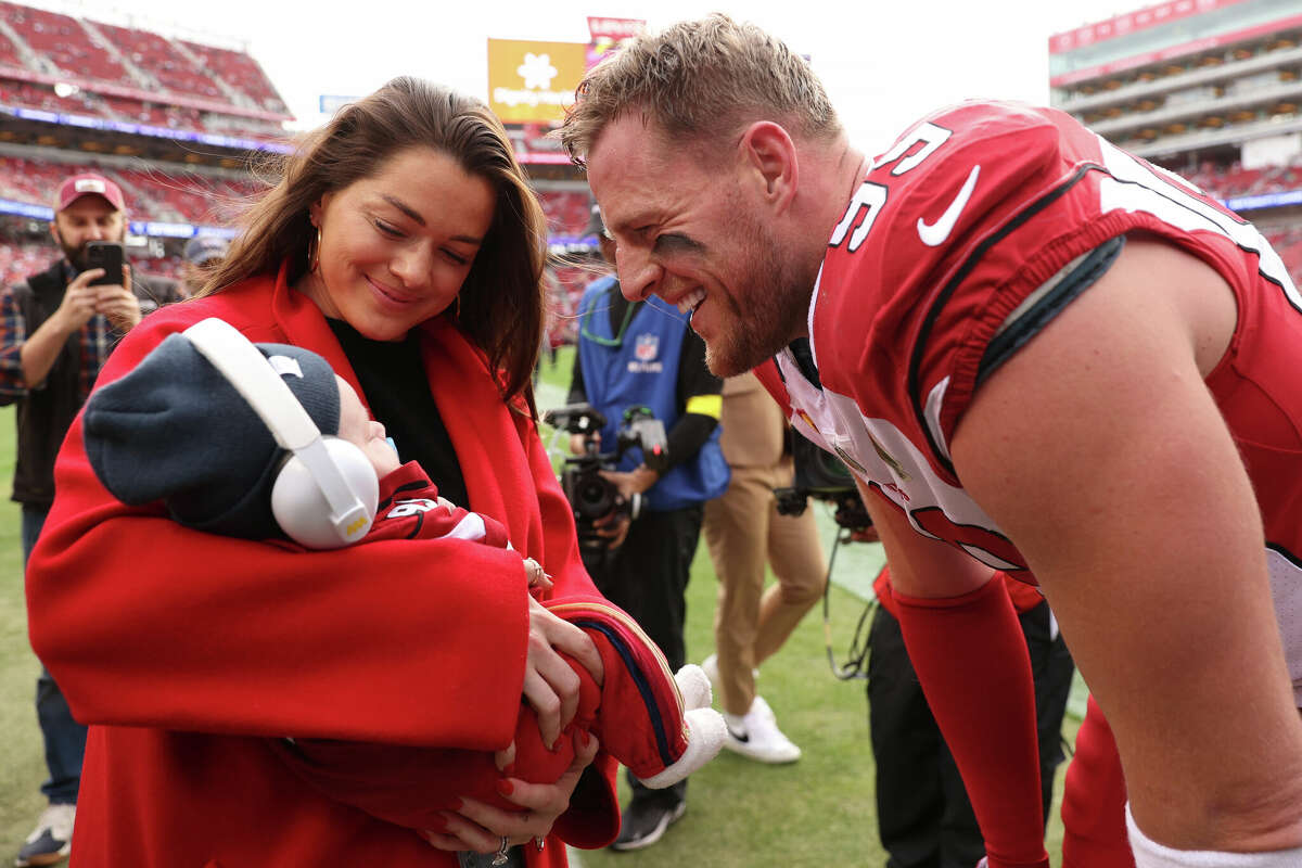 J.J. Watt talks with his wife Kealia and son Koa prior to playing his final NFL game when the Cardinals played the 49ers on Jan. 8, 2023 in Santa Clara, California.