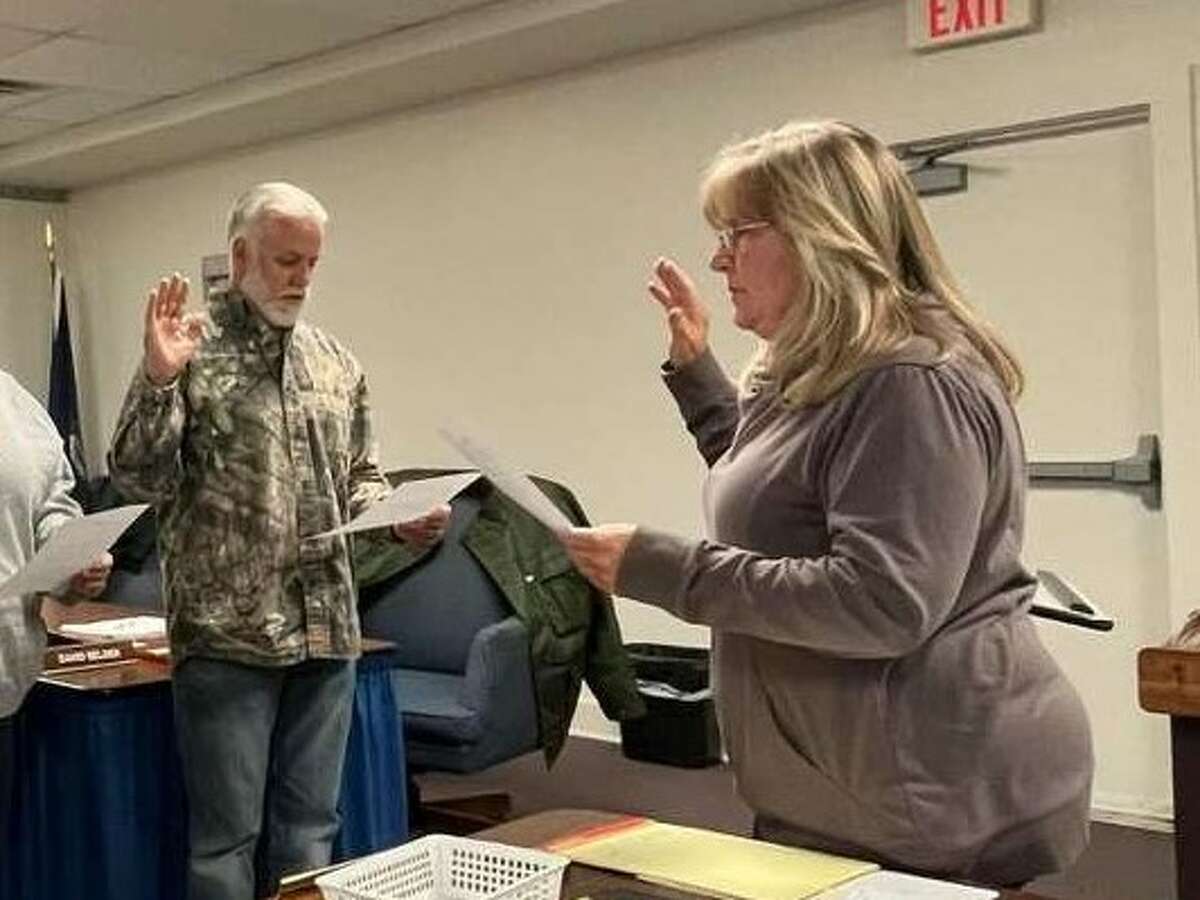 Reed City clerk Jackie Beam is retiring after 35 years with the city. Beam administers the oath of office to newly elected officials.