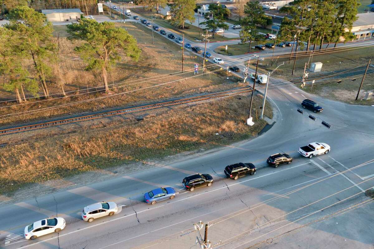 Traffic backs up along Texas 242 and Ford Road, Tuesday, Jan. 10, 2023, in New Caney. Ford Road is one of the last projects for Precinct 4 from the 2015 Road Bond. Once completed, the $11 million project will expand the roadway to two lawns on either side.