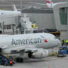 American Airlines planes sit on the tarmac at Terminal B at LaGuardia Airport in New York, Wednesday, Jan. 11, 2023. (AP Photo/Seth Wenig)