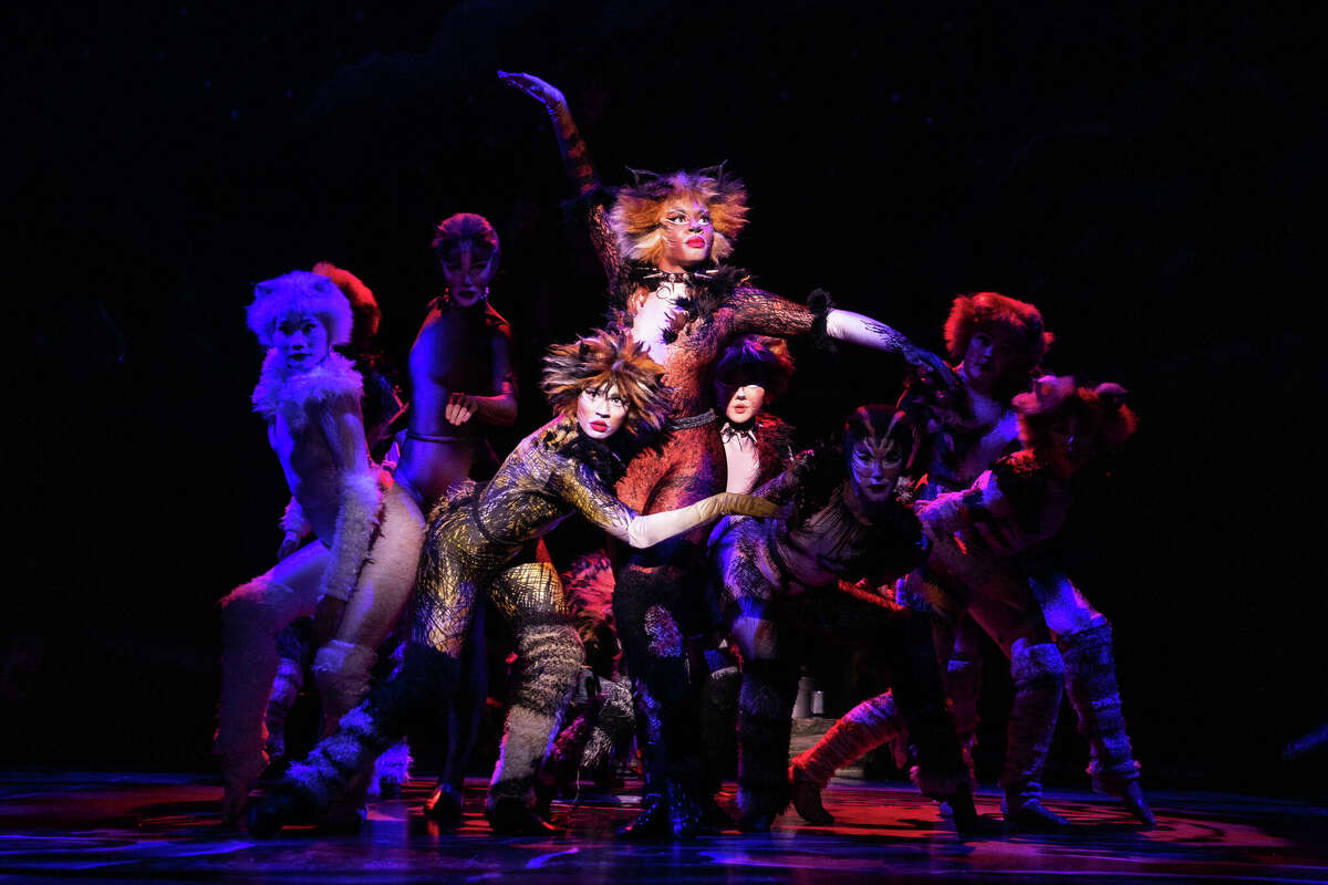 Lauren Louis as Demeter, Chelsea Nicole Mitchell as Bombalurina and the company of the 2021-2022 national tour of Cats.