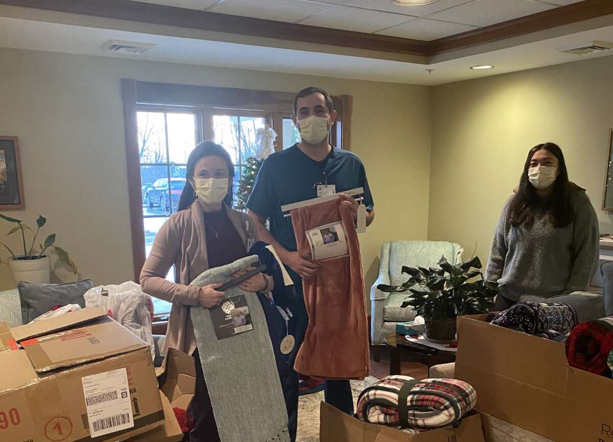 Olivia Bailey (far right) donated over 100 blankets to Munson Healthcare Hospice on Dec. 30 in the name of her brother, Justin Bailey, who died on Jan. 6, 2021. 