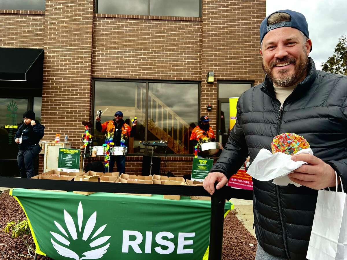 Kris Stock makes a purchase on the first day of retail cannabis sales at RISE in  Branford  on Jan. 10, 2023.