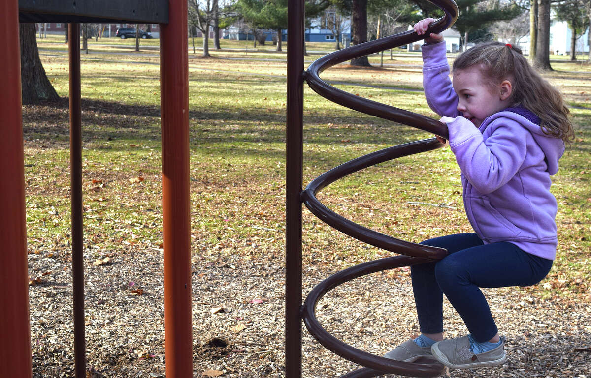 Maddie Chumley, 4, the daughter of Mike and Dakota Chumley of Jacksonville, enjoys the mild winter weather while playing at Duncan Park. After reaching the high 50s Wednesday, temperatures are expected to be more seasonable for the rest of the week, according to the National Weather Service.