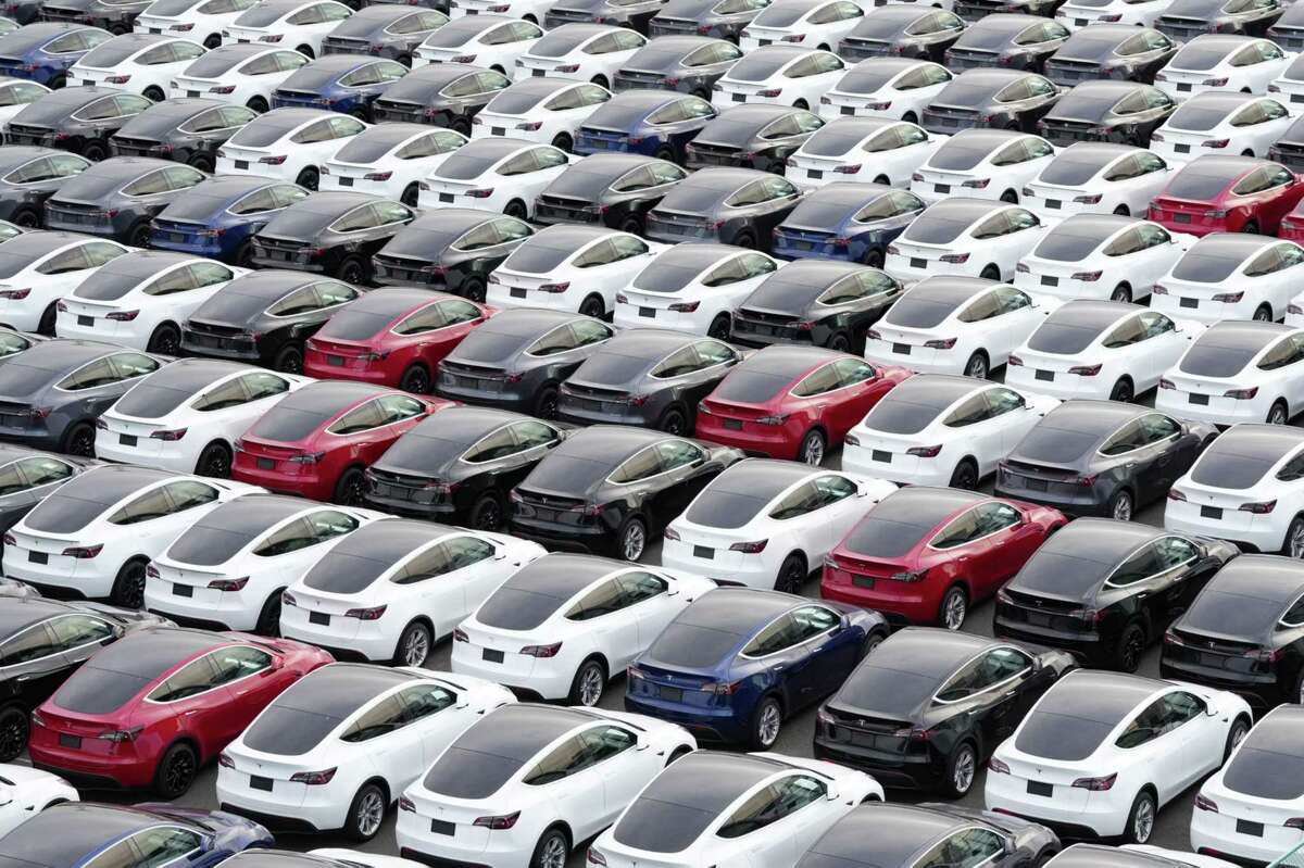 Tesla vehicles in a parking lot after arriving at a port in Yokohama, Japan, on Oct. 28.
