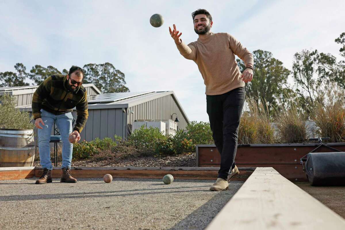 Anaba Wines in Sonoma offers several tasting experiences that seem curated specifically for Millennials. From left: Amin Jahani and Eamon Jahani play bocce at Anaba, which also has a pickleball and paddle tennis court. 