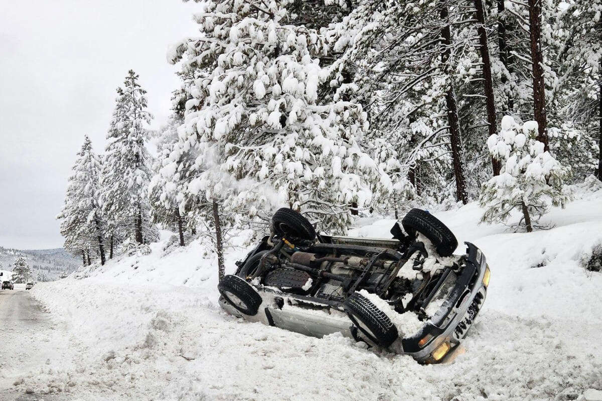 A flipped car in Truckee, Calif., is seen on Jan. 11. As a string of storms hits California, the National Weather Service is warning against travel in the Lake Tahoe area.
