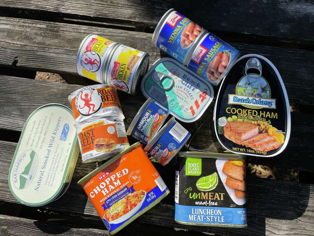 An assortment of canned meats used for the Food Shack taste test includes (clockwise from left): Bar Harbor Natural Smoked Wild Kippers, Underwood Roast Beef Spread, Beach Cliff Fish Steaks, Libby's Vienna Sausage, Dutch Colony Cooked Ham, CPG Unmeat, Armour Potted Meat and H-E-B Chopped Ham.