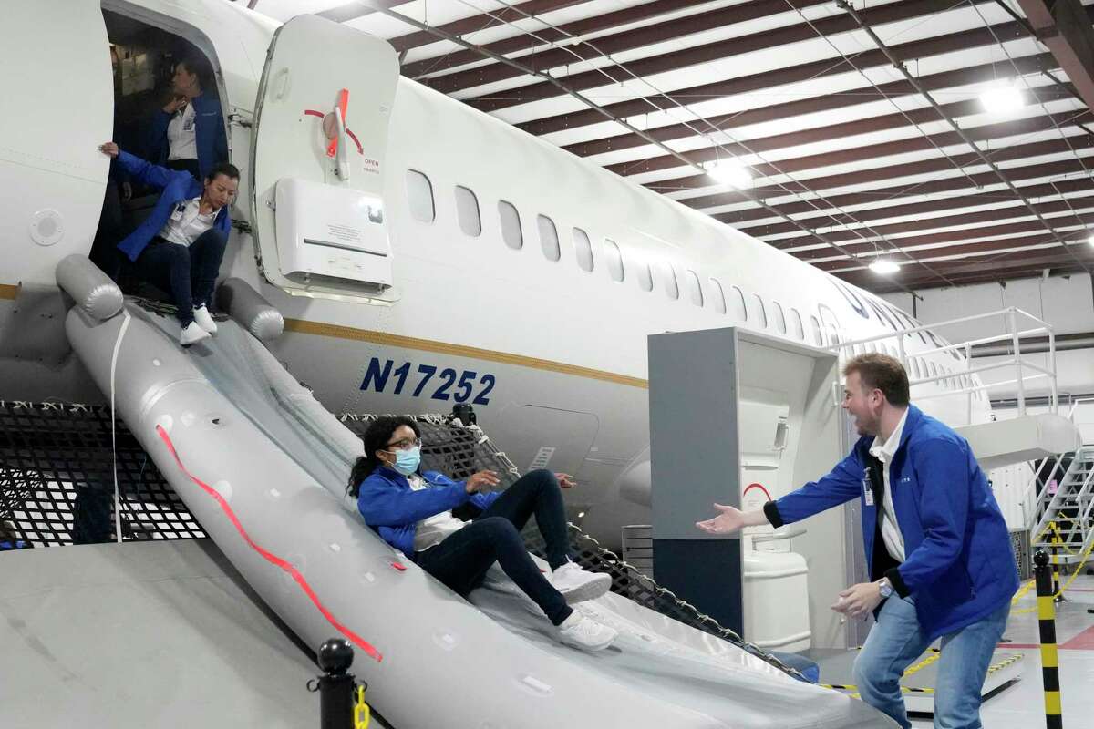 Evacuation training is shown at the new United Airlines Inflight Training Center at George Bush Intercontinental Airport Wednesday, Jan. 11, 2023, in Houston.