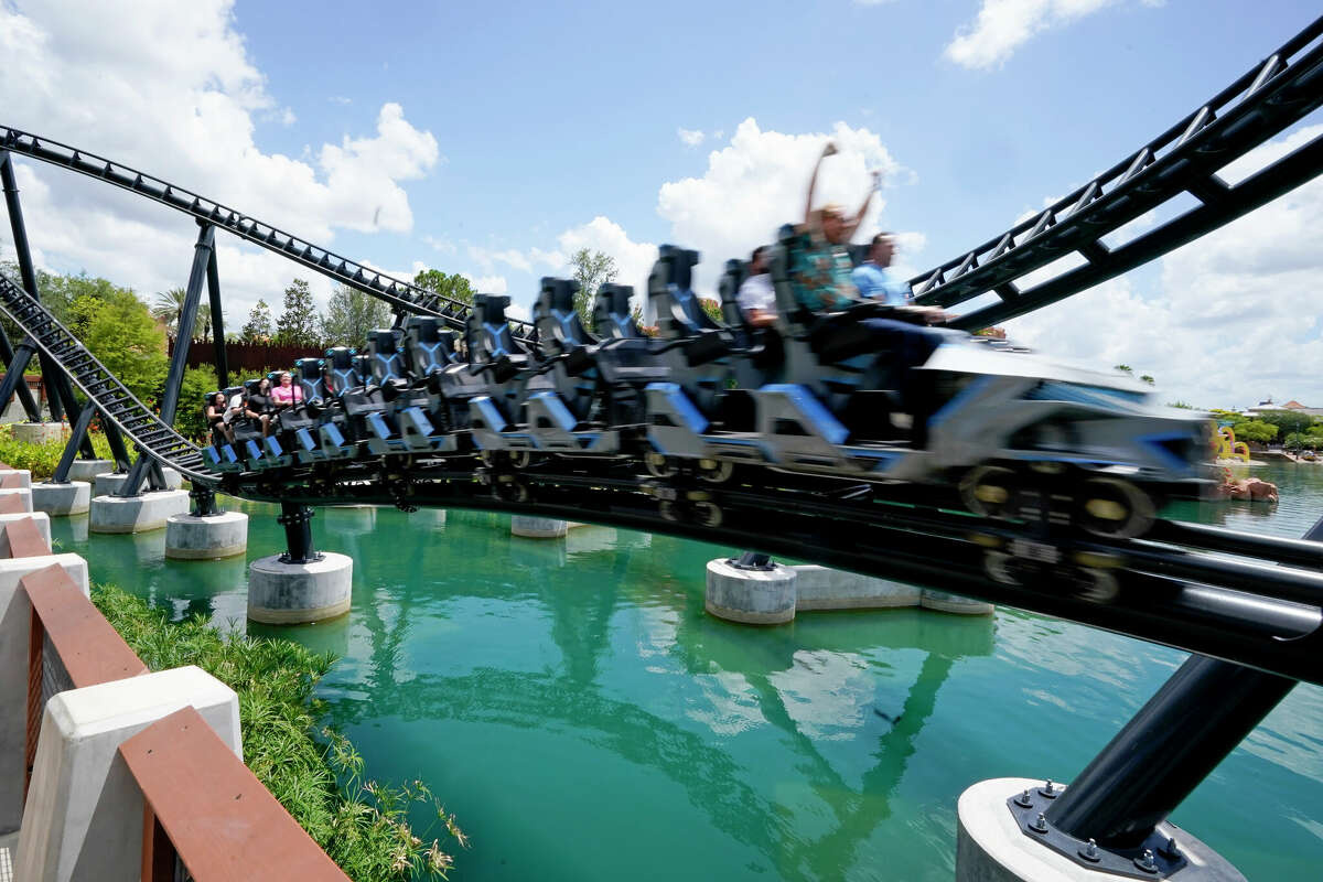 Guests try out the new Jurassic World VelociCoaster during a media preview at Universal Studios theme park Wednesday, June 9, 2021, in Orlando, Fla. The roller coaster will open to the public Thursday. (AP Photo/John Raoux)