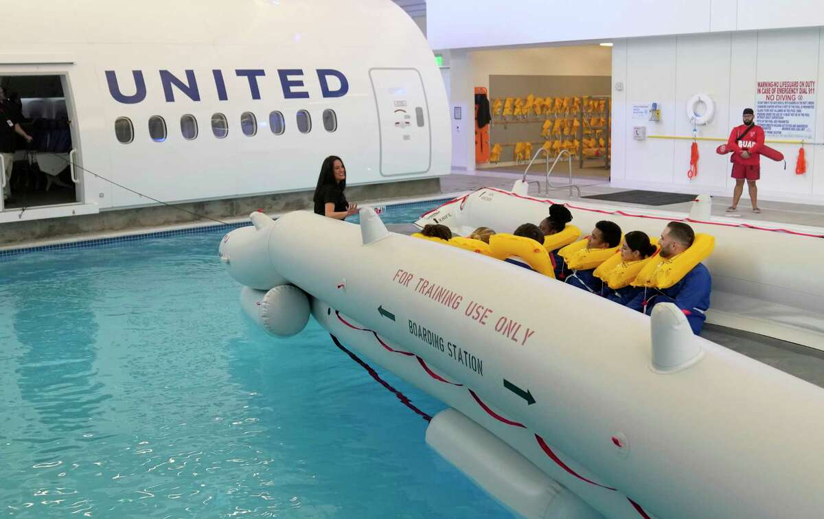 Flight attendant trainees demonstrate water evacuation training in the new United Airlines Inflight Training Center at George Bush Intercontinental Airport Wednesday, Jan. 11, 2023, in Houston.