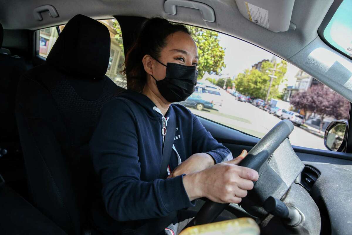 Saori Okawa drives a delivery of groceries to an Instacart customer in San Francisco in 2021.