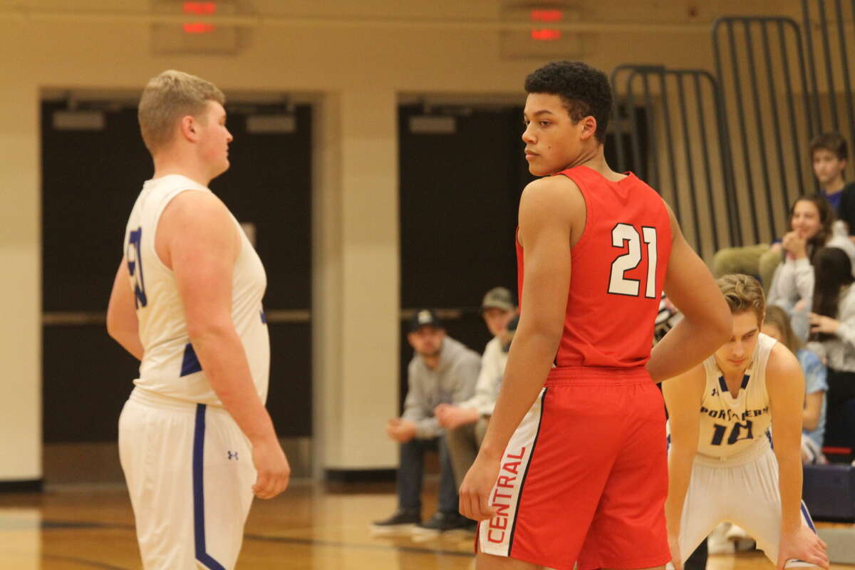 Onekama's Adam Domres (left) and Benzie Central's Miles Pritchett (right) prepare to tip off on Jan. 11.