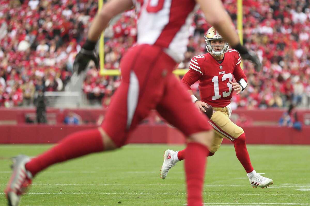 San Francisco 49ers’ Brock Purdy rolls out in 3rd quarter of 38-13 win over Arizona Cardinals in NFL game at Levi’s Stadium in Santa Clara, Calif., on Sunday, January 8, 2023.