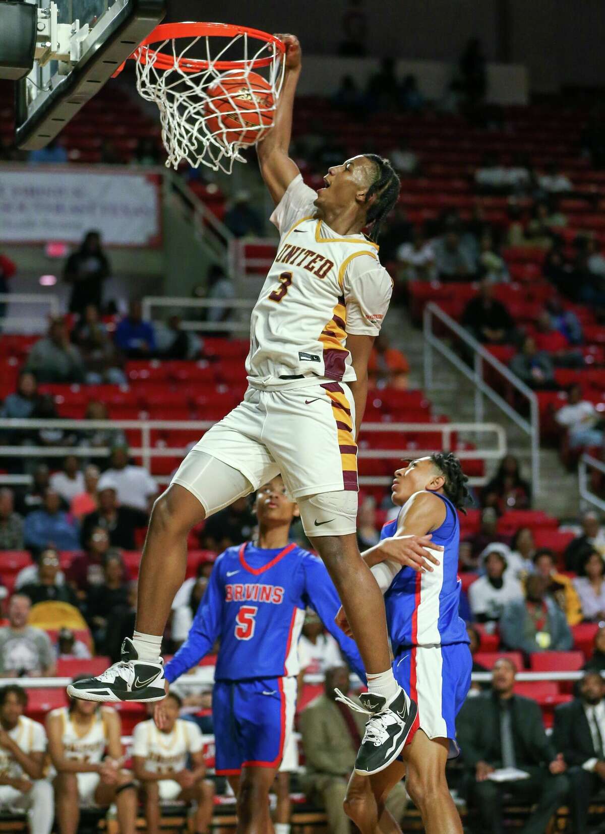 United guard Wesley Yates dunks the ball during a game against West Brook at the Montagne Center in Beaumont.