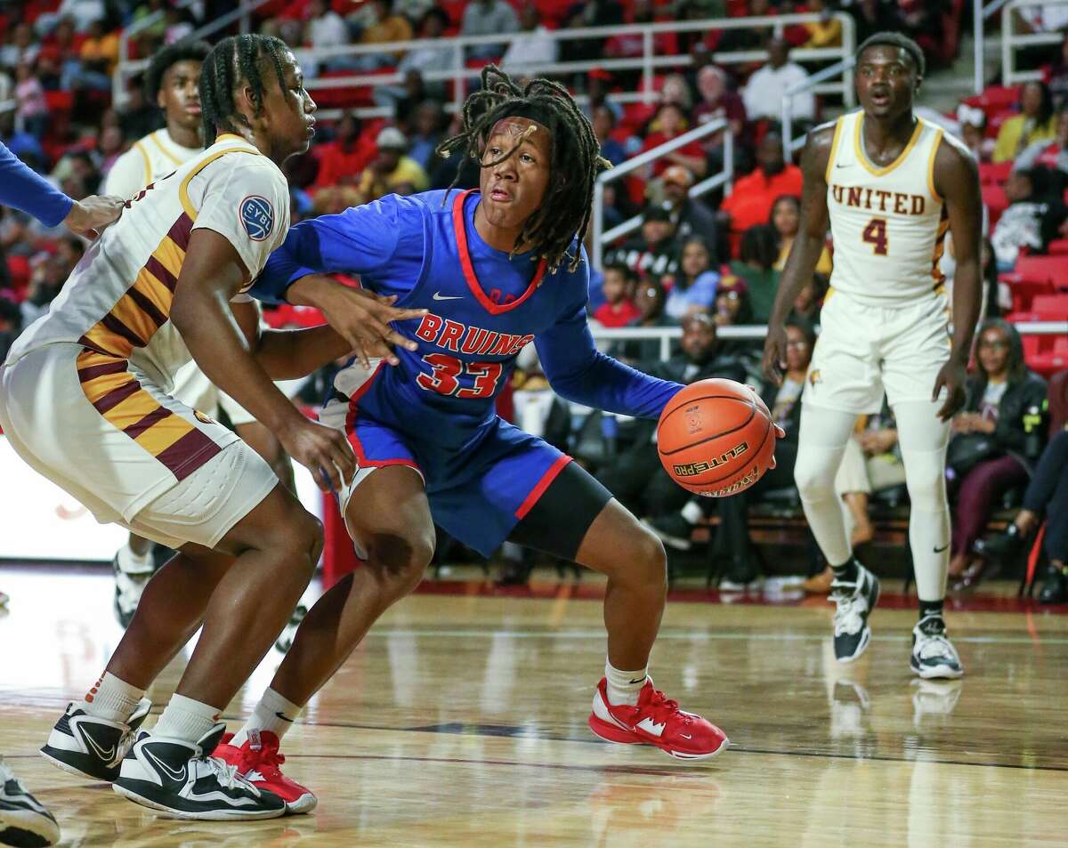 West Brook forward Jaylin Jones dribbles the ball during a game against Beaumont United at the Montagne Center.