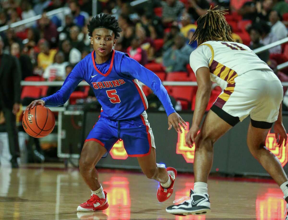 West Brook guard Elijah Garrett dribbles the ball during a game against Beaumont United at the Montagne Center.