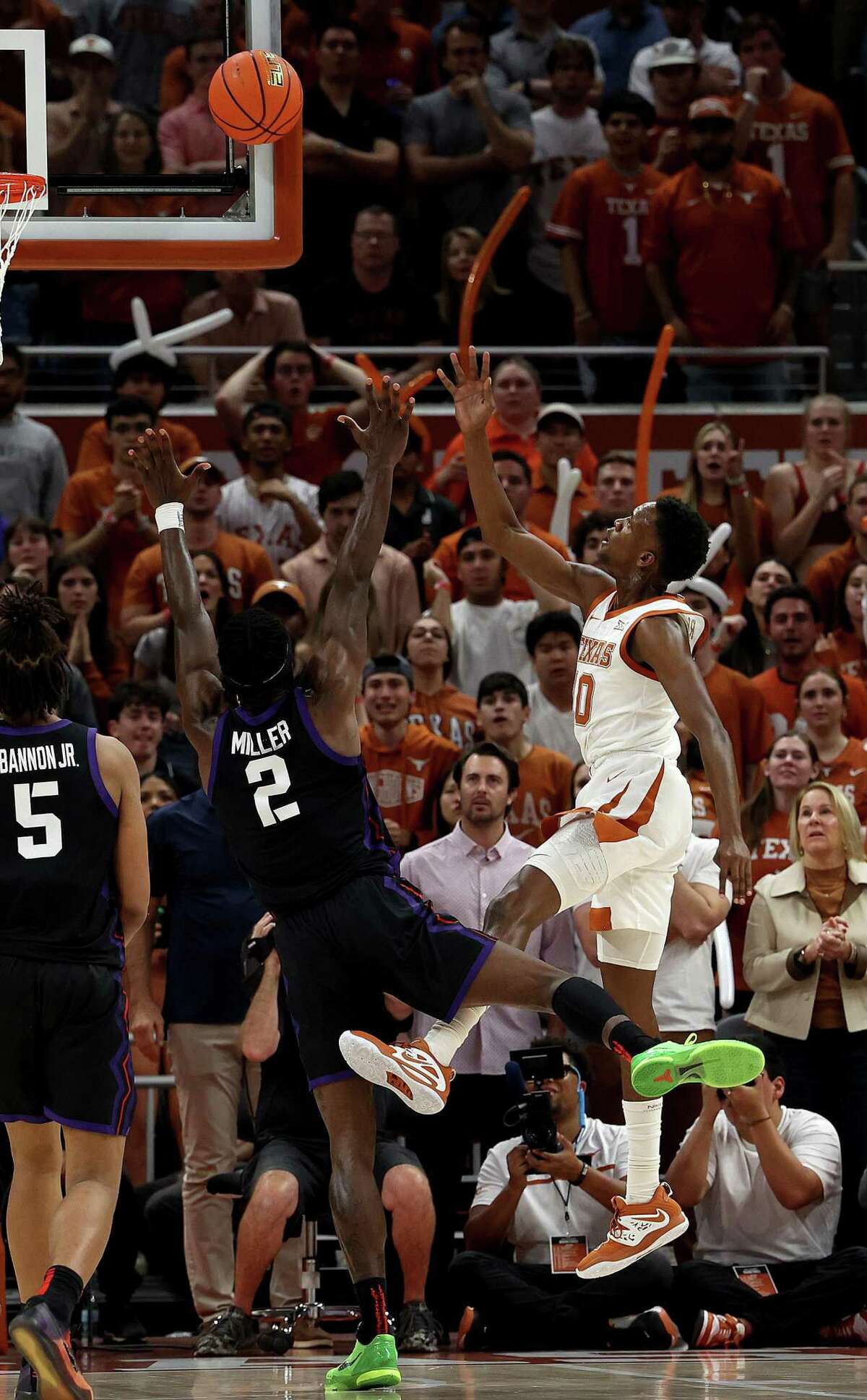 Texas’ Sir'Jabari Rice shoots over TCU’s Emanuel Miller during second half of Wednesday night’s game at Moody Center in Austin.