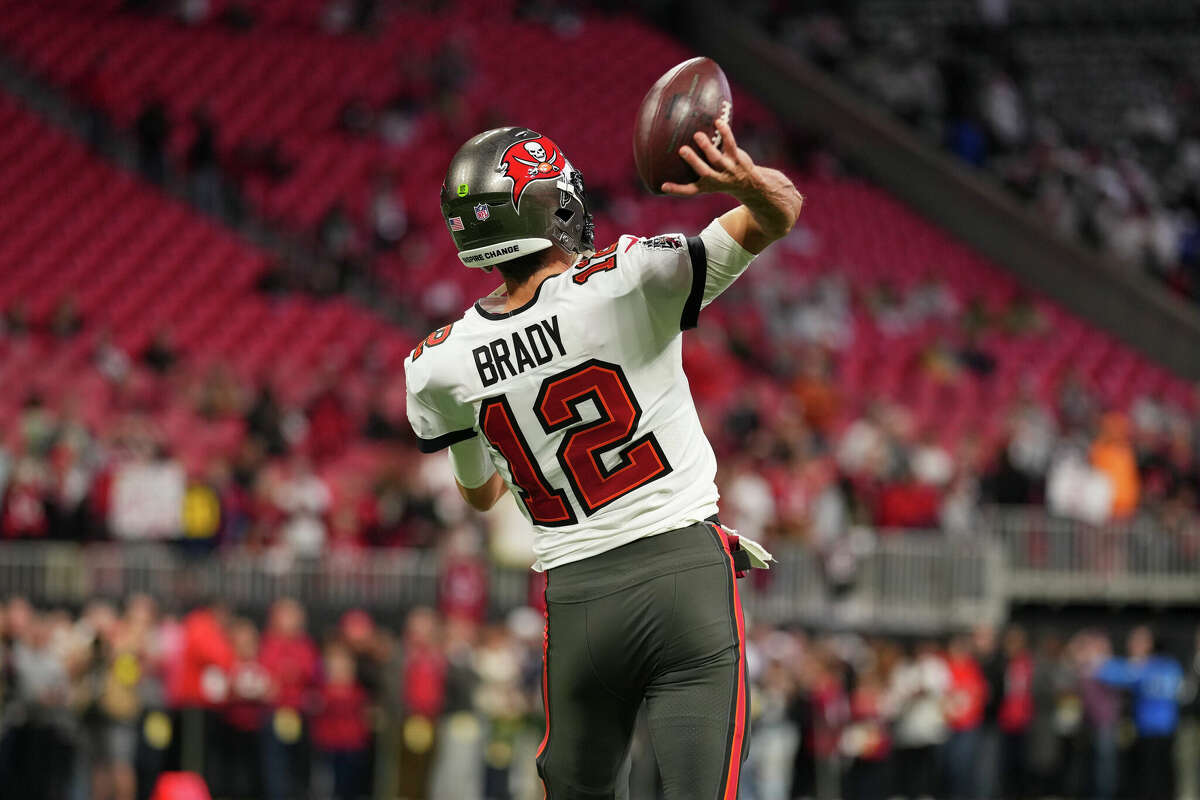 ATLANTA, GA - JANUARY 08: Tom Brady #12 of the Tampa Bay Buccaneers warms up against the Atlanta Falcons at Mercedes-Benz Stadium on January 8, 2023 in Atlanta, Georgia. (Photo by Cooper Neill/Getty Images)