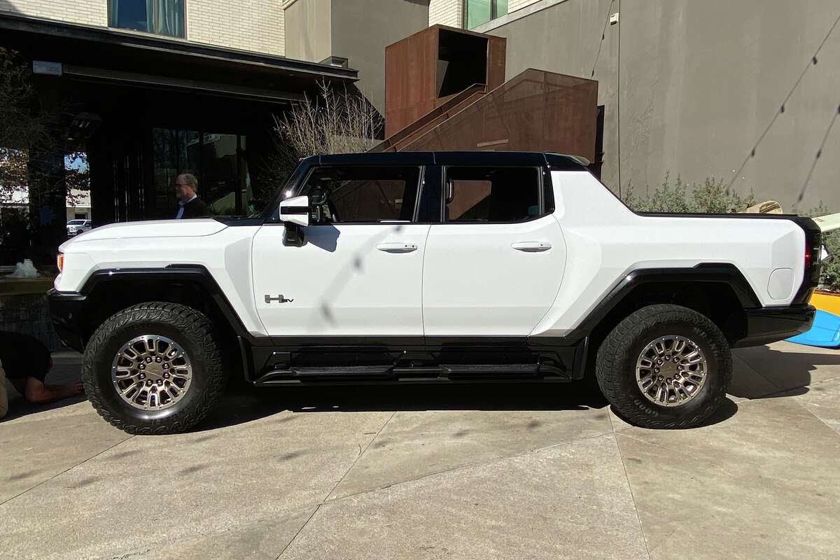 Story photo for Tomlinson: GM's new Hummer challenges Elon Musk and Tesla.