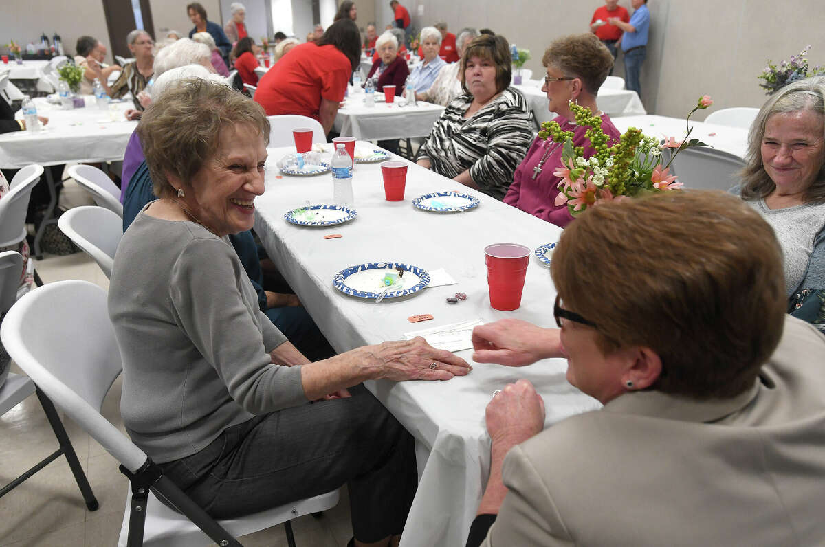 Jasper Hospital auxiliary volunteer Frieda Eubanks talks with Shanna Burke, Executive Director of the Southeast Texas Regional Planning Commission, during a thank you luncheon for volunteers with the Jasper County RSVP program at the courthouse annex. Photo made Wednesday, January 11, 2023 Kim Brent/Beaumont Enterprise
