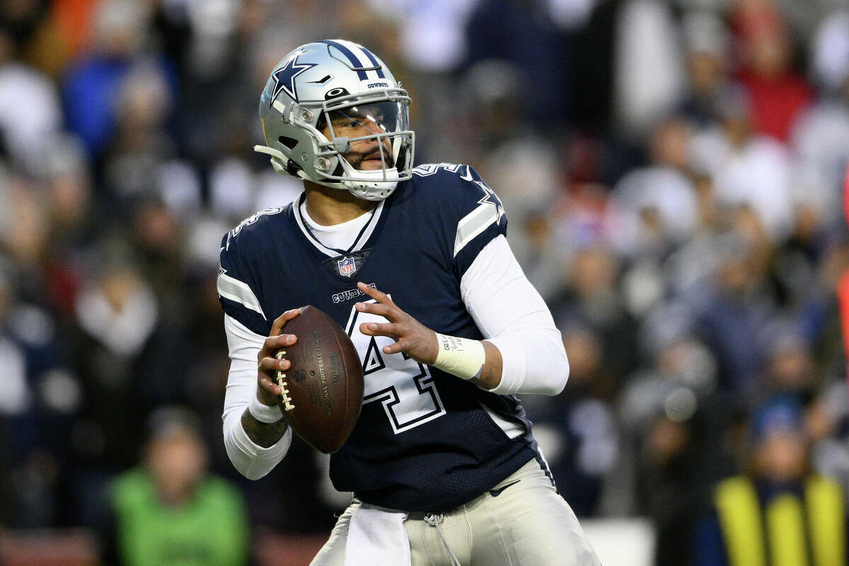 Dallas Cowboys quarterback Dak Prescott (4) in action during the first half of an NFL game against the Washington Commanders, Sunday, Jan. 8, 2023, in Landover, Md.